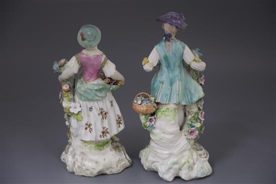 A pair of large Derby figures of flower sellers, c.1760, H. 26.5 and 24.5cm